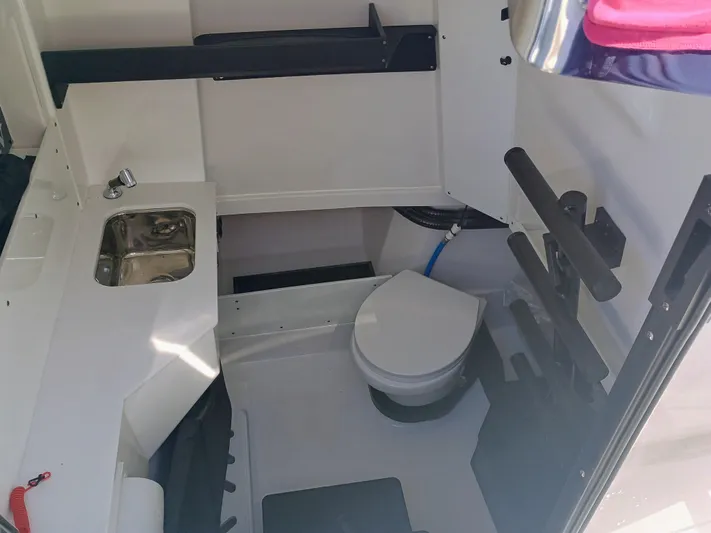 332-299 Yacht Photos Pics 2025 Blackfin 332 CC boat interior with sink and toilet.