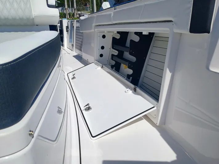 332-299 Yacht Photos Pics 2025 Blackfin 332 CC boat storage compartment with open hatch, showcasing interior design.