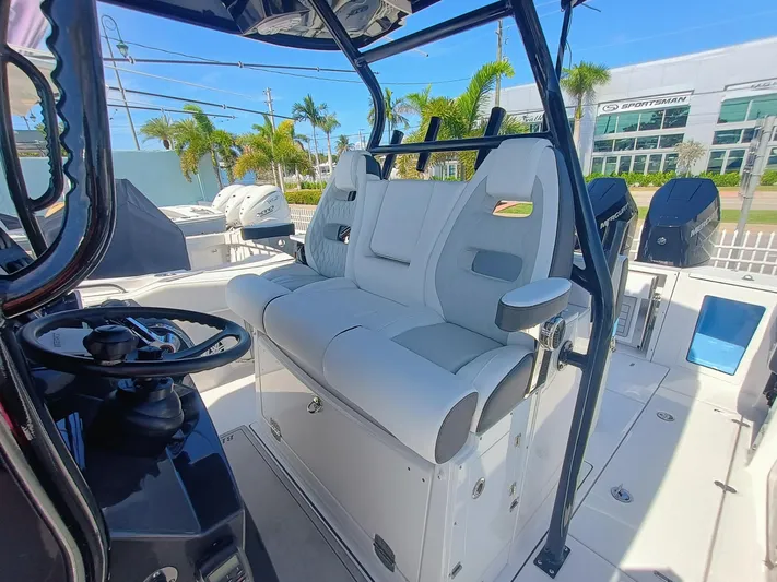 332-299 Yacht Photos Pics 2025 Blackfin 332 CC boat interior with modern seating and steering console.