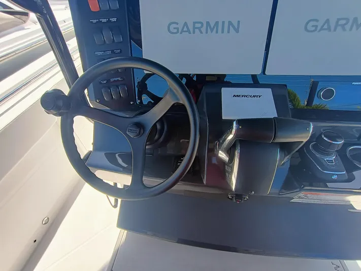 332-299 Yacht Photos Pics 2025 Blackfin 332 CC helm with Garmin displays and Mercury controls.