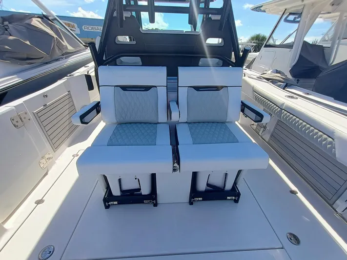 332-299 Yacht Photos Pics 2025 Blackfin 332 CC boat interior with luxurious seating and modern design.