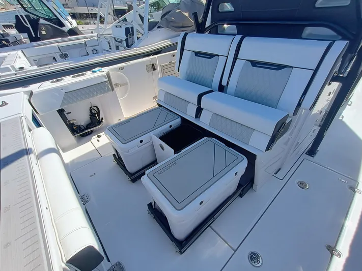 332-299 Yacht Photos Pics 2025 Blackfin 332 CC boat interior with seating and storage compartments.