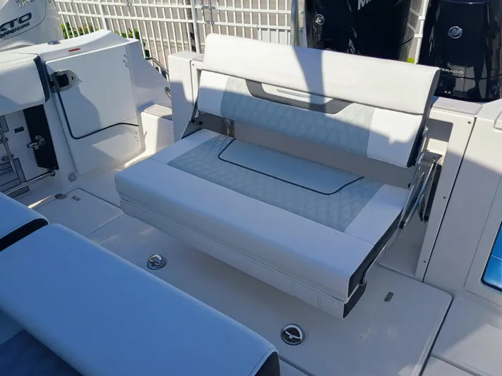 332-299 Yacht Photos Pics 2025 Blackfin 332 CC boat interior with foldable seating and modern design.