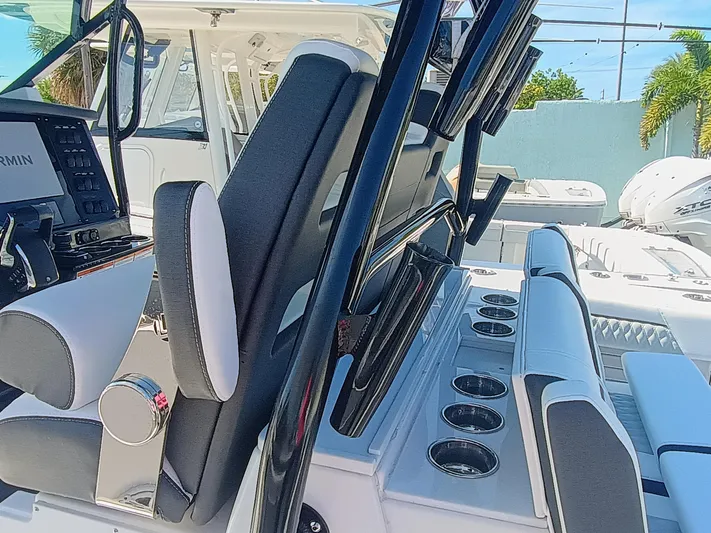 332-299 Yacht Photos Pics 2025 Blackfin 332 CC boat interior with seating and control panel.