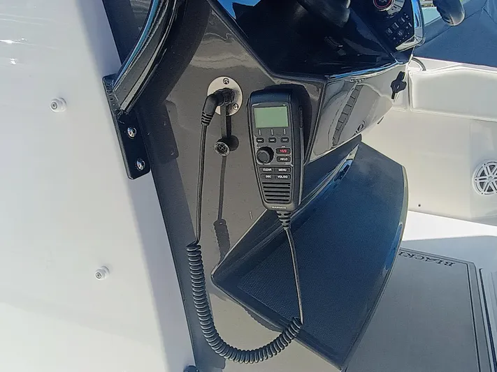 332-299 Yacht Photos Pics 2025 Blackfin 332 CC boat console with mounted marine radio.
