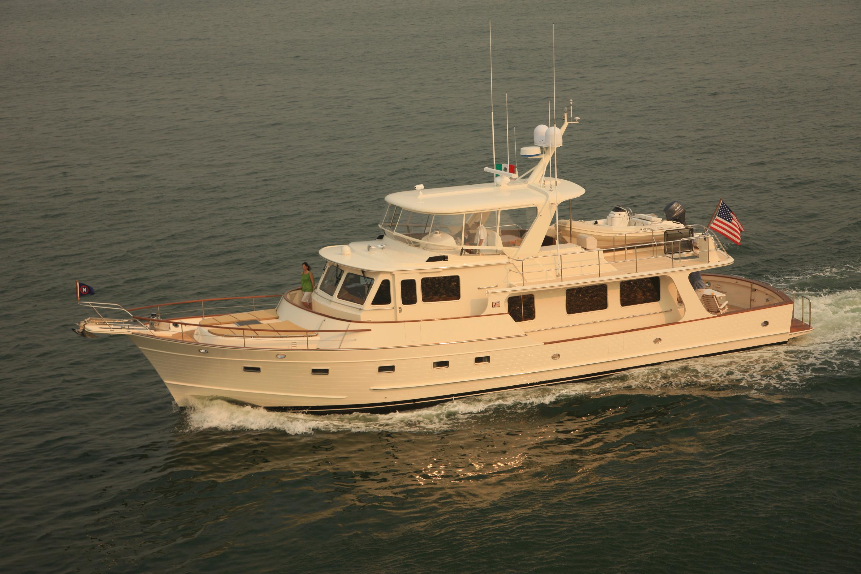 2026 Fleming 65 Pilothouse yacht cruising on open water.