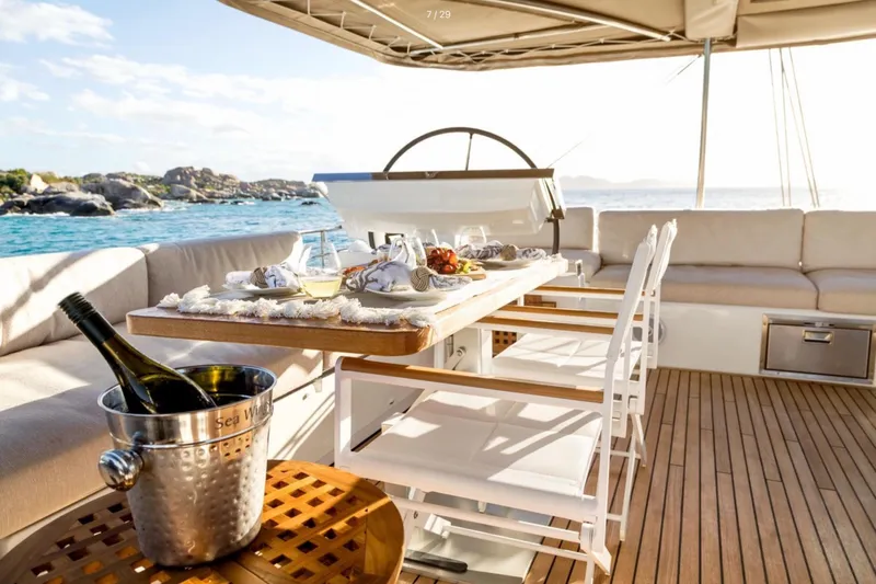  Yacht Photos Pics Luxurious Lagoon 620 yacht deck with elegant dining setup, 2018 model.