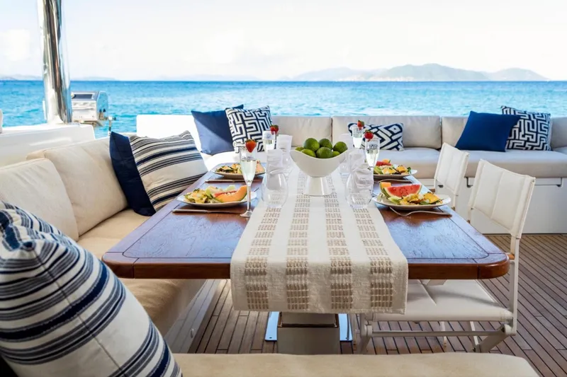  Yacht Photos Pics Luxurious dining setup on Lagoon 620 yacht, 2018 model, with ocean view and elegant decor.