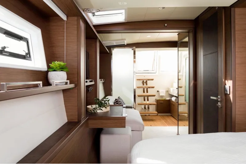  Yacht Photos Pics Luxurious interior of 2018 Lagoon 620 yacht with modern wood finishes and elegant decor.