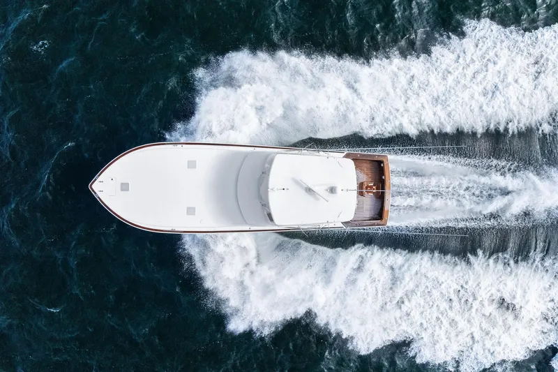 Bait Waster Yacht Photos Pics Aerial view of 2001 Viking 61 yacht cruising through ocean waves.