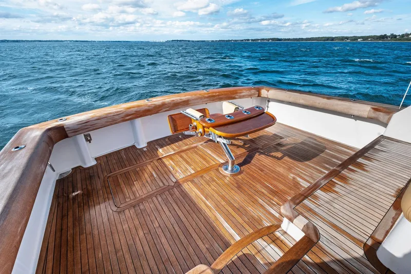 Bait Waster Yacht Photos Pics Teak deck of 2001 Viking 61 yacht with ocean view and fishing chair.