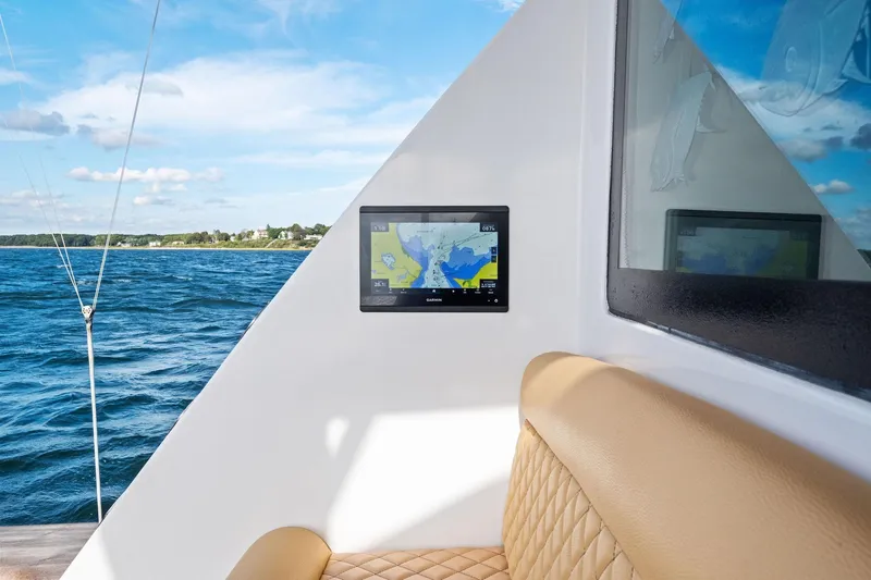 Bait Waster Yacht Photos Pics Luxurious 2001 Viking 61 yacht interior with navigation display, overlooking serene ocean view.