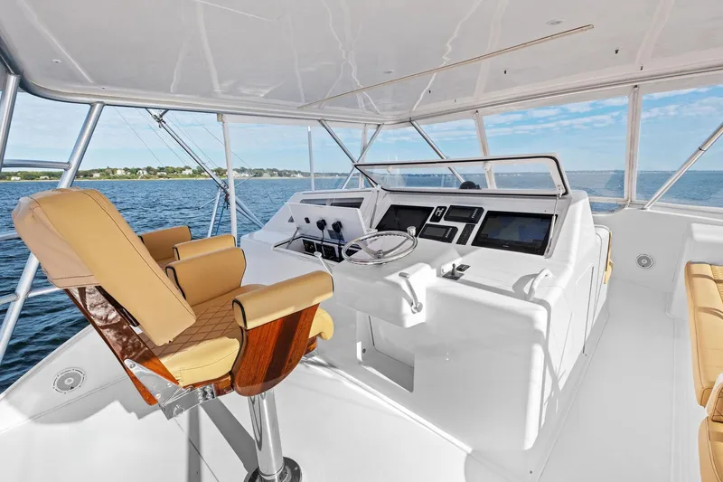 Bait Waster Yacht Photos Pics Helm of 2001 Viking 61 yacht with luxurious seating and modern controls.