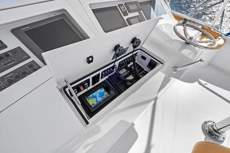 Bait Waster Yacht Photos Pics 2001 Viking 61 yacht helm with navigation equipment and steering wheel.