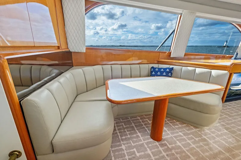 Bait Waster Yacht Photos Pics Luxurious interior of 2001 Viking 61 yacht with elegant seating and ocean view.
