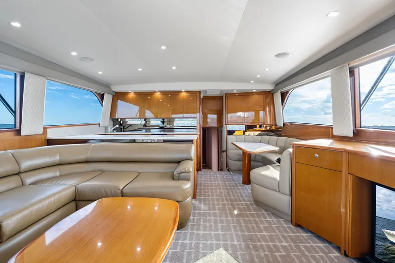 Bait Waster Yacht Photos Pics Luxurious interior of a 2001 Viking 61 yacht with leather seating and wooden finishes.