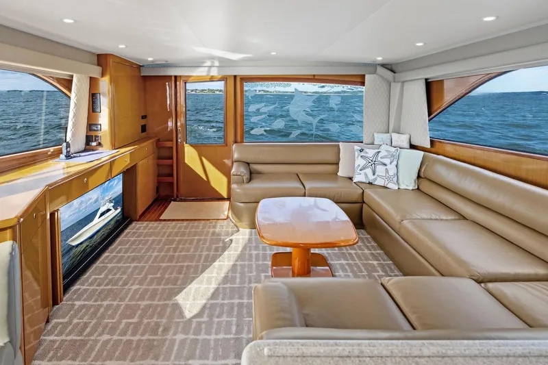 Bait Waster Yacht Photos Pics Luxurious interior of a 2001 Viking 61 yacht with leather seating and ocean views.