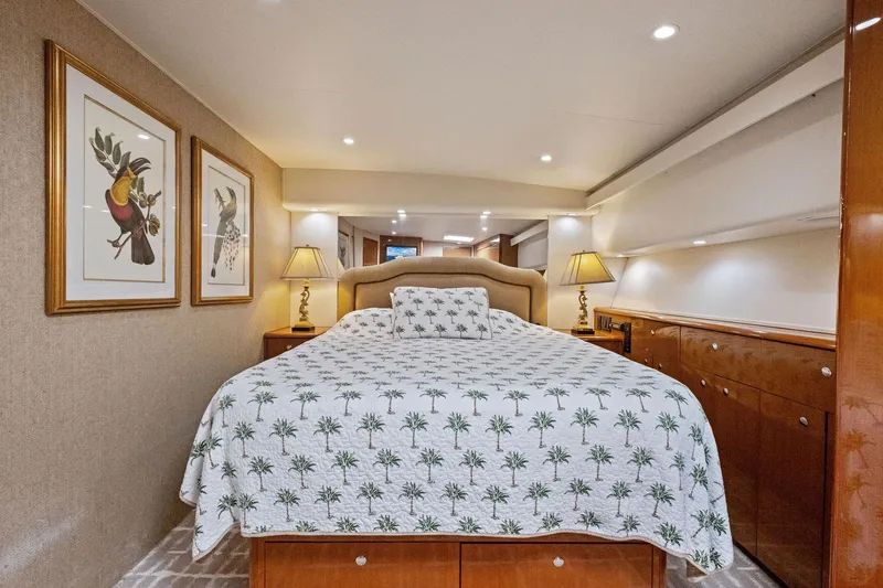 Bait Waster Yacht Photos Pics Luxurious bedroom interior of 2001 Viking 61 yacht with elegant decor and lighting.