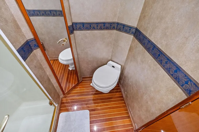 Bait Waster Yacht Photos Pics Luxurious bathroom in 2001 Viking 61 yacht with elegant wood flooring.