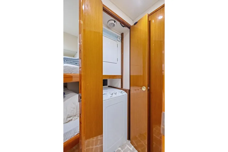 Bait Waster Yacht Photos Pics Laundry area in 2001 Viking 61 yacht with stacked washer and dryer.