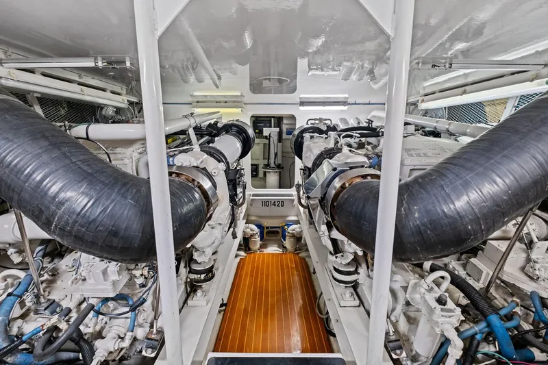 Bait Waster Yacht Photos Pics Engine room of a 2001 Viking 61 yacht, showcasing dual engines and mechanical components.