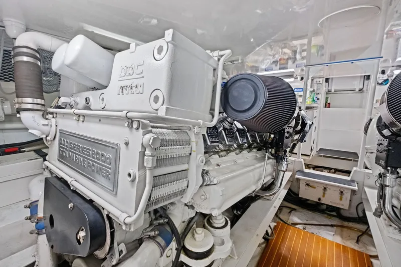 Bait Waster Yacht Photos Pics Engine room of a 2001 Viking 61 yacht featuring a powerful marine engine.