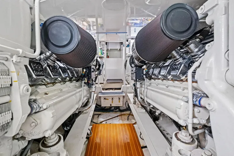 Bait Waster Yacht Photos Pics Engine room of a 2001 Viking 61 yacht, showcasing dual engines and clean design.