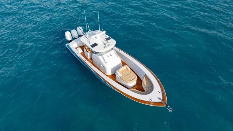 Off Course (name Reserved) Yacht Photos Pics 2018 Winter Custom Yachts 37 Custom Carolina boat on open water, aerial view.