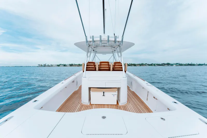 Off Course (name Reserved) Yacht Photos Pics 2018 Winter Custom Yachts 37 Custom Carolina boat on open water, showcasing sleek design and spacious deck.