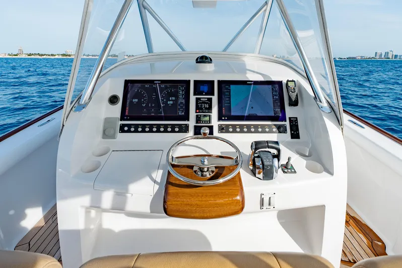 Off Course (name Reserved) Yacht Photos Pics 2018 Winter Custom Yachts 37 Custom Carolina helm with dual screens, steering wheel, and ocean view.