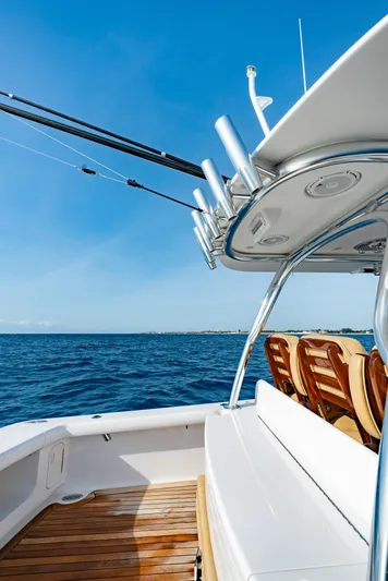 Off Course (name Reserved) Yacht Photos Pics 2018 Winter Custom Yachts 37 Custom Carolina on open sea, clear sky, wooden deck.