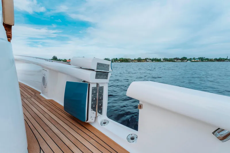 Off Course (name Reserved) Yacht Photos Pics 2018 Winter Custom Yachts 37 Custom Carolina on water, showcasing deck and railing.