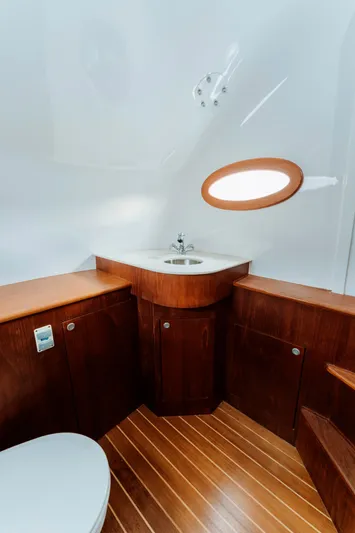 Off Course (name Reserved) Yacht Photos Pics Luxurious 2018 Winter Custom Yachts 37 Custom Carolina yacht bathroom with wood accents and modern fixtures.