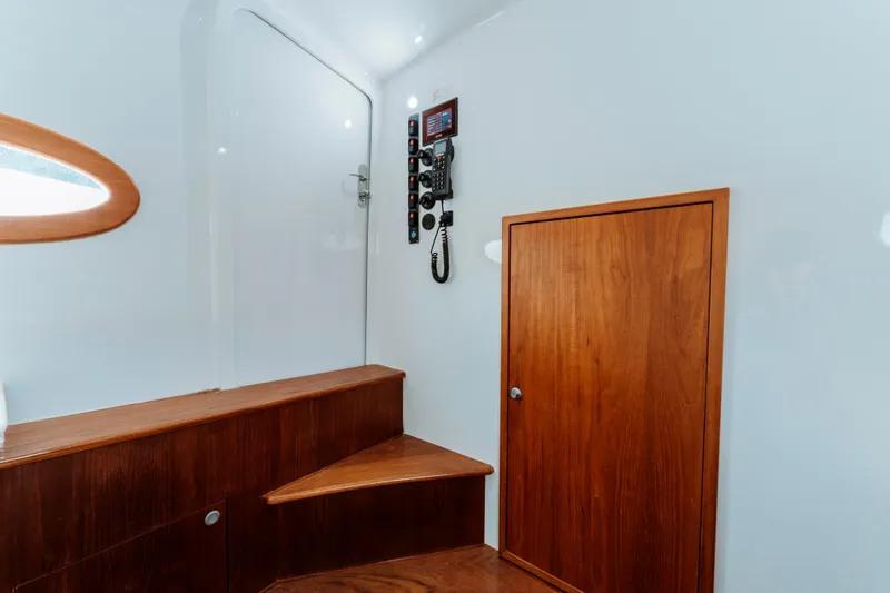 Off Course (name Reserved) Yacht Photos Pics Interior of 2018 Winter Custom Yachts 37 Custom Carolina, featuring wooden steps and paneling.