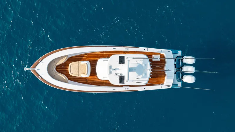 Off Course (name Reserved) Yacht Photos Pics Aerial view of 2018 Winter Custom Yachts 37 Custom Carolina on blue ocean water.