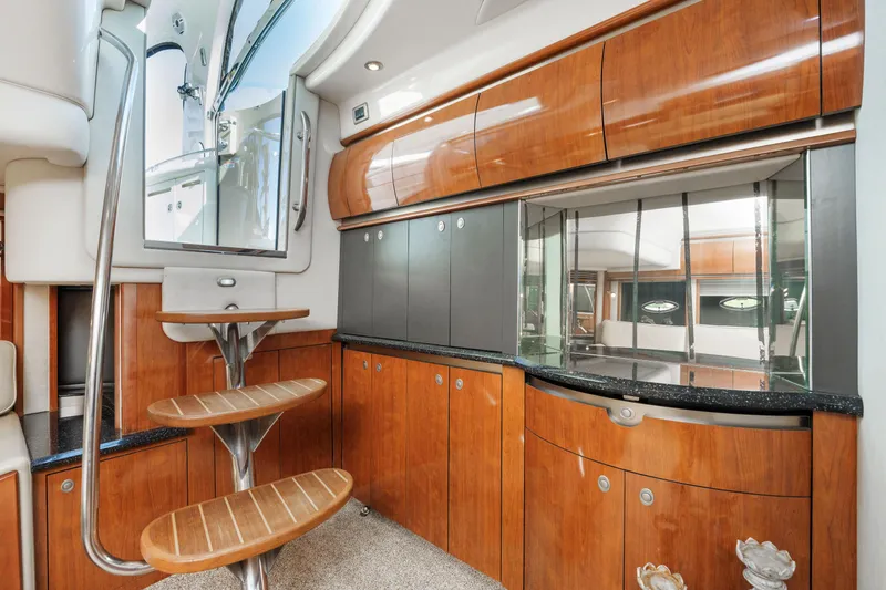 Jo's Diamond Yacht Photos Pics Luxurious 2004 Sea Ray 500 Sundancer interior with elegant wood cabinetry and spiral staircase.