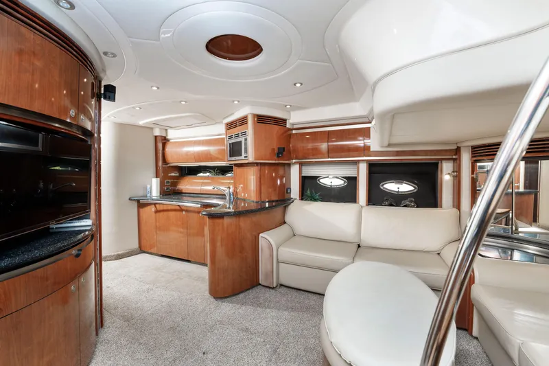 Jo's Diamond Yacht Photos Pics Luxurious interior of 2004 Sea Ray 500 Sundancer yacht with modern furnishings.