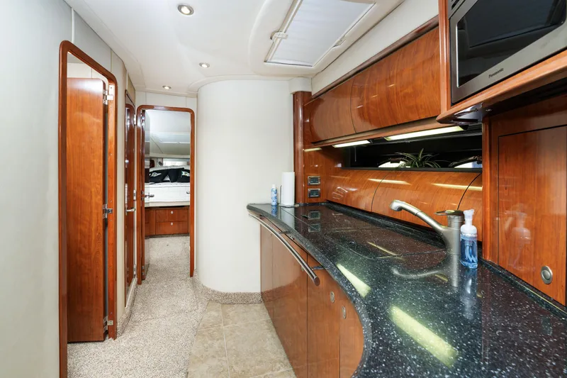 Jo's Diamond Yacht Photos Pics Luxurious interior of 2004 Sea Ray 500 Sundancer yacht with sleek wood finishes.