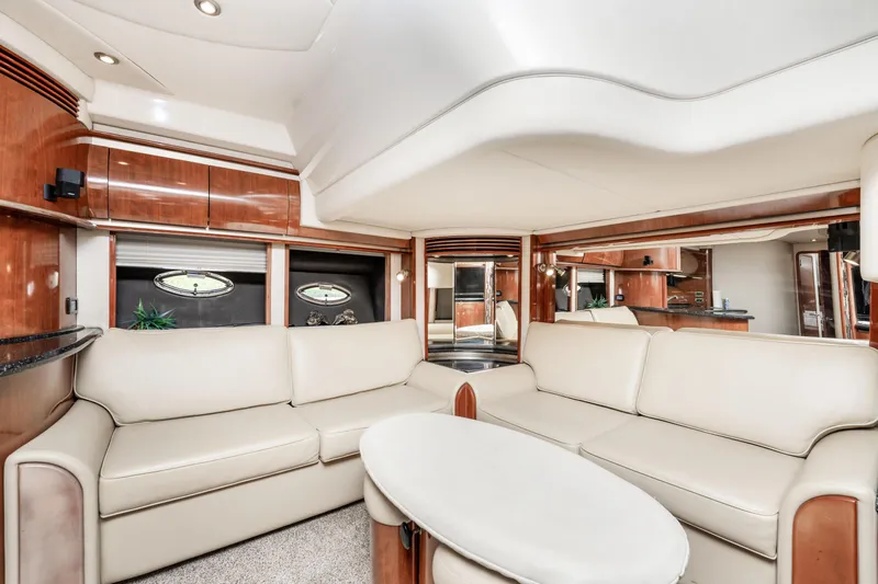 Jo's Diamond Yacht Photos Pics Luxurious interior of 2004 Sea Ray 500 Sundancer yacht with elegant seating and wood finishes.