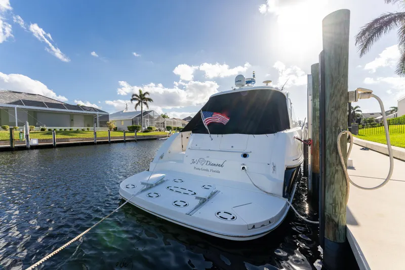 Jo's Diamond Yacht Photos Pics 2004 Sea Ray 500 Sundancer yacht docked in sunny marina.