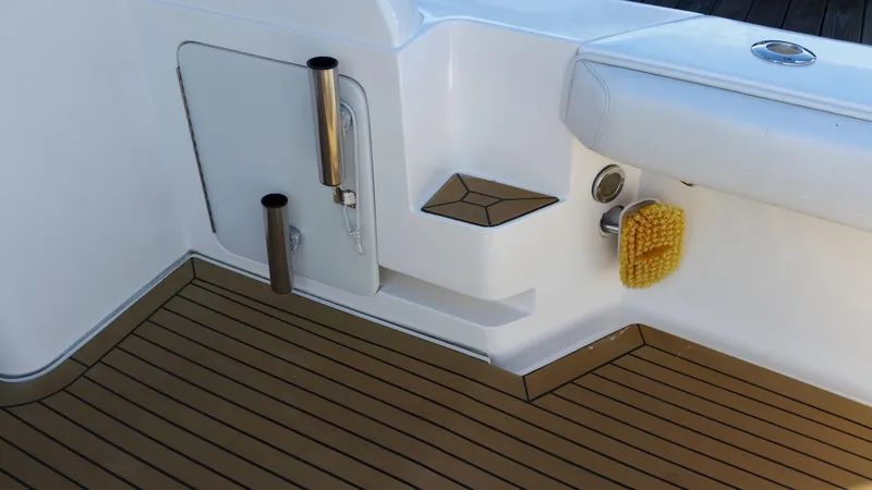 Mai Time Yacht Photos Pics 2001 Bertram 390 Convertible boat deck with teak flooring and fishing rod holders.