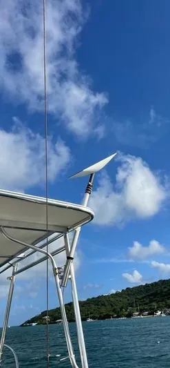 Padre Pio Yacht Photos Pics 1986 Grand Banks 42 Classic boat with antenna, blue sky, and coastal background.
