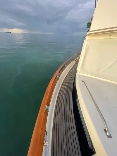 Padre Pio Yacht Photos Pics 1986 Grand Banks 42 Classic yacht on calm sea under cloudy sky.