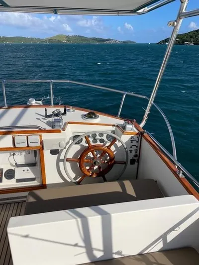 Padre Pio Yacht Photos Pics 1986 Grand Banks 42 Classic yacht helm with ocean view and distant islands.