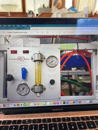 Padre Pio Yacht Photos Pics Control panel of a 1986 Grand Banks 42 Classic boat, featuring gauges and colorful wiring.