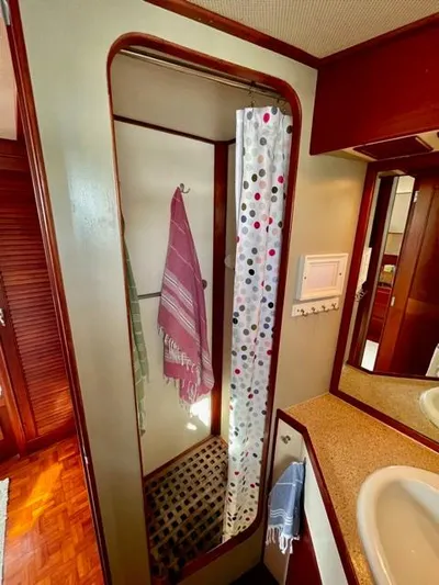 Padre Pio Yacht Photos Pics 1986 Grand Banks 42 Classic yacht bathroom with shower and polka dot curtain.
