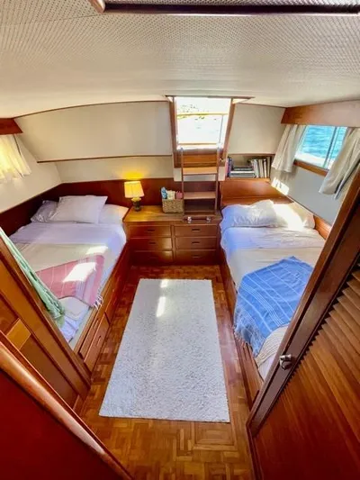 Padre Pio Yacht Photos Pics 1986 Grand Banks 42 Classic cabin with twin beds, wooden interior, and natural light.