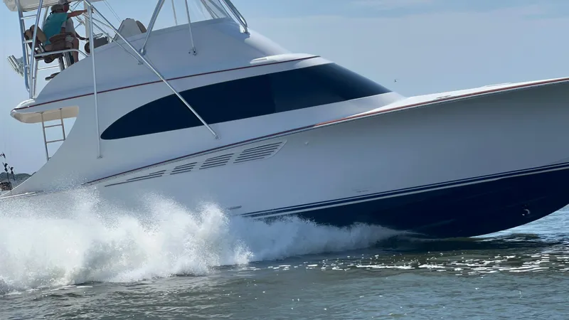  Yacht Photos Pics 2024 Custom Carolina Albemarle Spencer yacht cruising on water, showcasing sleek design and speed.