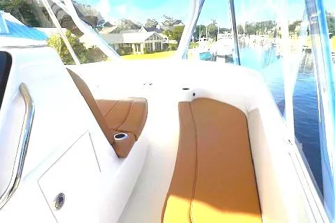  Yacht Photos Pics 2024 Custom Carolina Albemarle Spencer boat interior with tan seating and waterfront view.