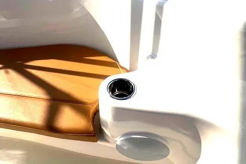  Yacht Photos Pics 2024 Custom Carolina Albemarle Spencer boat interior with tan leather seat and cup holder.
